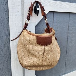 Original Dooney Bourke purse in the color brown and cream